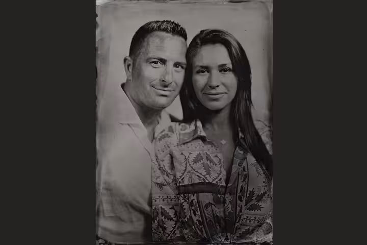 Couple posing for 19th century metal plate portrait photo in Porto, Portugal, vintage tintype experience