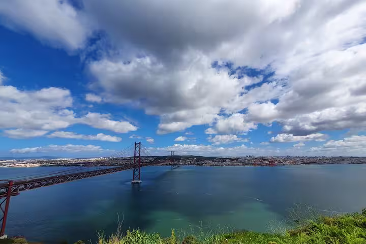 Stunning view of the 25 de Abril Bridge over the Tagus River, a highlight of the Arrábida, Azeitão, Setúbal, and Palmela tour.