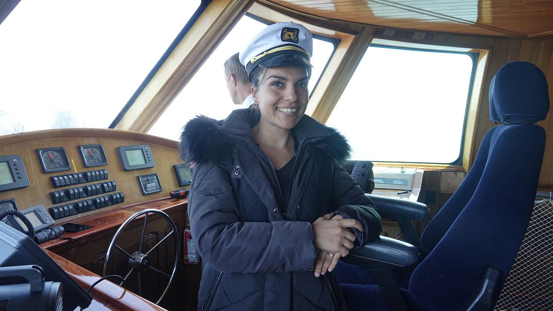 A staff member on board a whale watching vessel