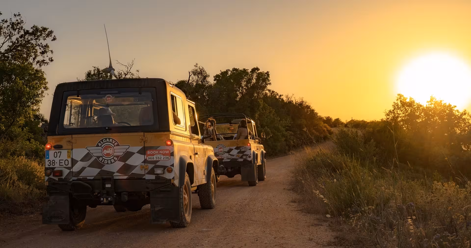 4x4 jeeps driving a dusty Algarve trail at golden sunset during Spirit & Springs off-road adventure and countryside tour