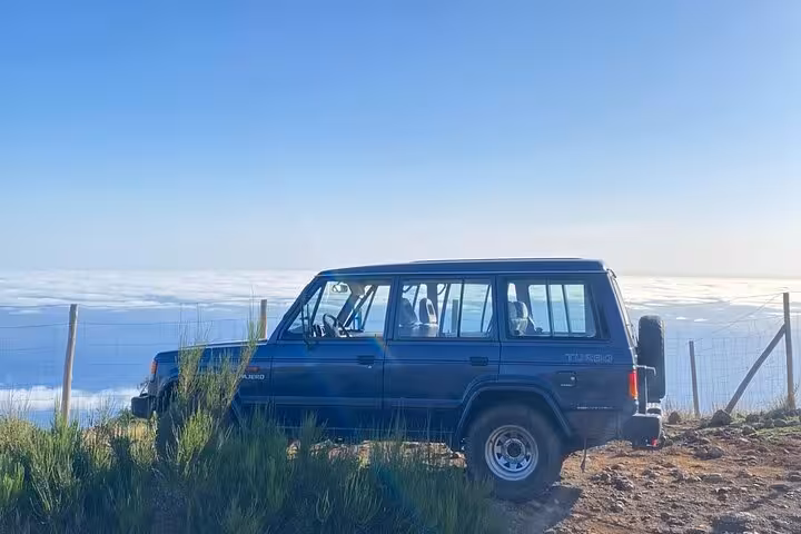 4x4 jeep at Madeira mountain viewpoint above the clouds on West Madeira Fanal Forest skywalk tour