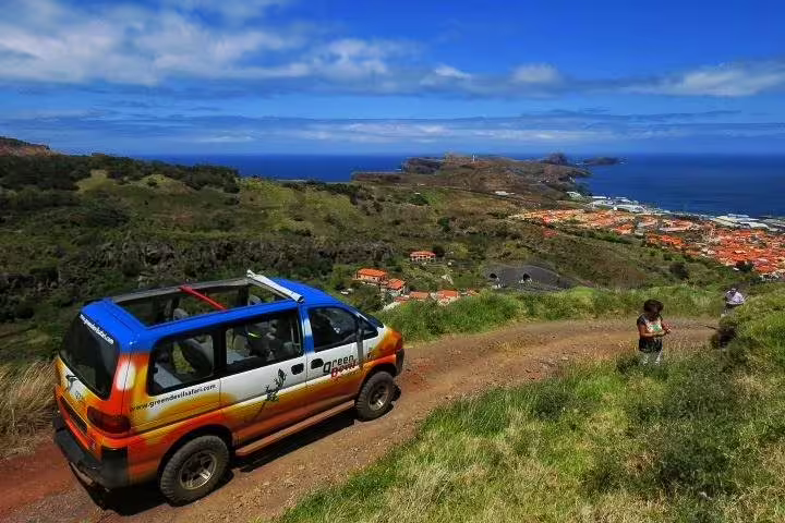 Off-road 4x4 overlooking stunning Portuguese coastal landscape, ideal for adventure and scenic tours.