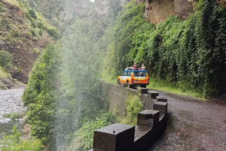 4x4 tour vehicle navigating lush, scenic landscapes of Northwest Madeira, offering adventure enthusiasts an exhilarating off-road experience.