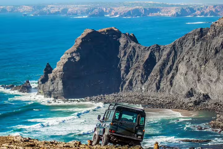 4x4 vehicle on rugged cliffs of the West Coast Natural Park with stunning ocean views on a half-day tour.