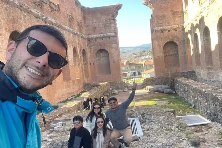 Group of tourists enjoying the historic Basilica of St. John, part of the 7 Churches of Revelation Tour.