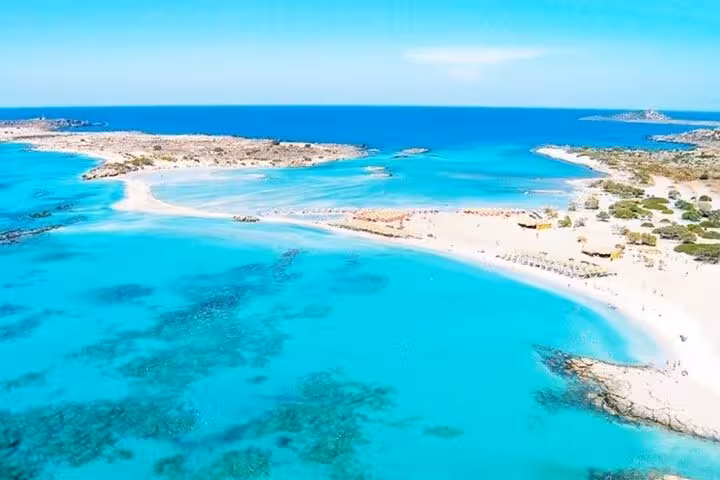 Aerial of Elafonissi-style turquoise lagoon and white sand, featured on a 7-day private guided Crete tour