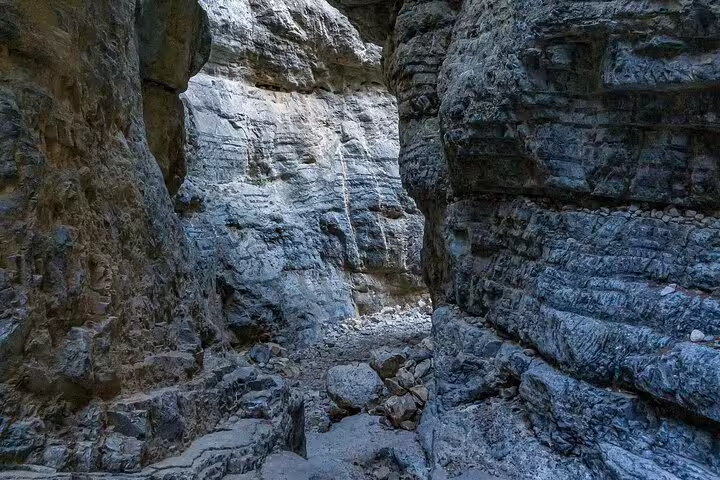 Experience the majestic rock formations of a narrow gorge on the 8 Days Hiking Tour in Southwest Crete from Chania.