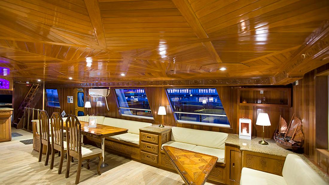 Inside of a luxurious yacht with seating area and comfortable lodgings
