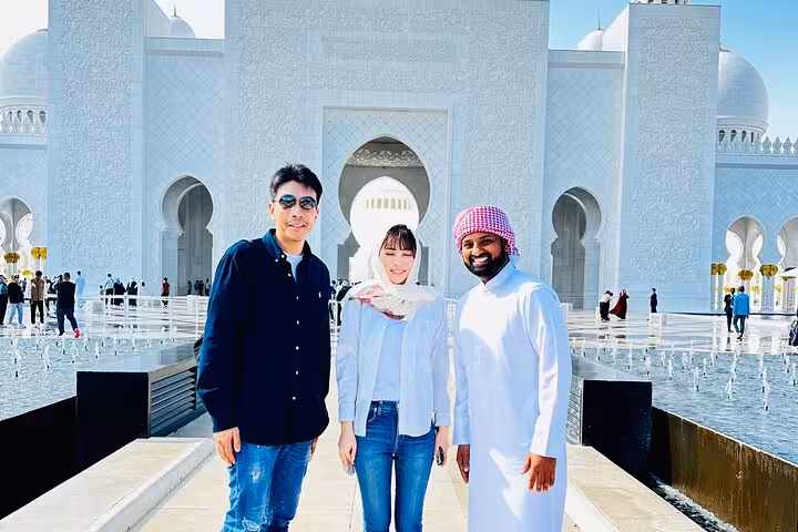 Tour guests at Sheikh Zayed Grand Mosque on Abu Dhabi city tour with Etihad Towers 300M coffee stop