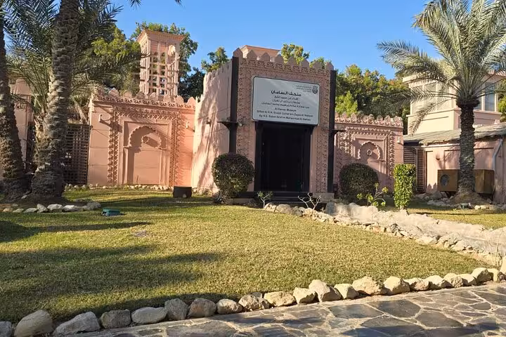 Abu Dhabi Heritage Village entrance on Ras Al Khaimah day trip, traditional architecture and gardens