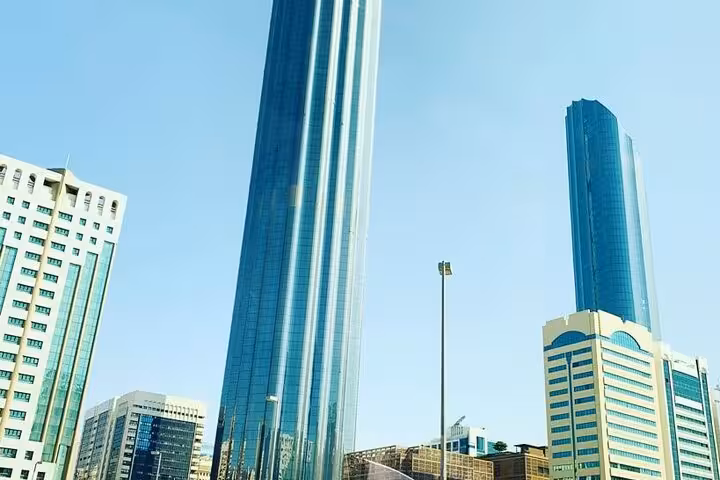 Abu Dhabi skyline skyscrapers on layover sightseeing tour with private airport transfers from Abu Dhabi Airport