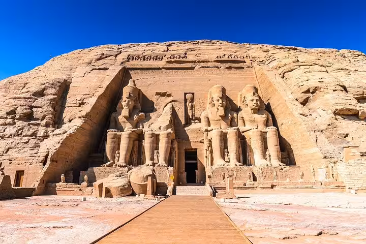 Front view of Abu Simbel Great Temple, Ramses II colossi, on a full-day Abu Simbel tour from Aswan