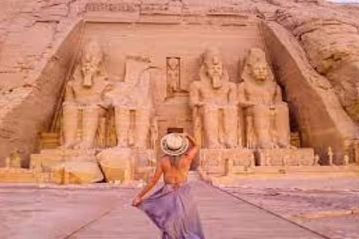 Traveler at Abu Simbel Great Temple of Ramses II, highlight of Luxor to Aswan day trip tour
