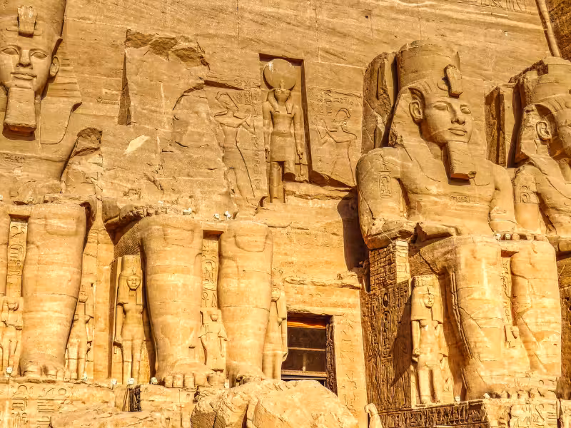 Colossal statues at Abu Simbel temple facade in Egypt, iconic ancient monuments on Nile tours