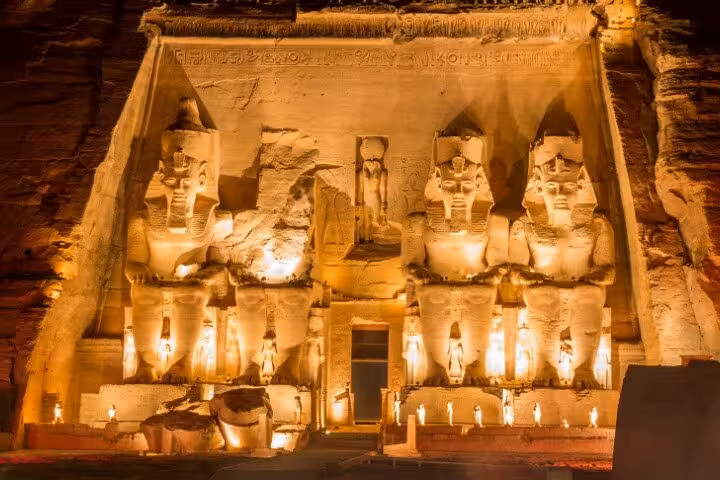 Illuminated Abu Simbel Great Temple at night, VIP tour with flight from Aswan to see Ramses II statues