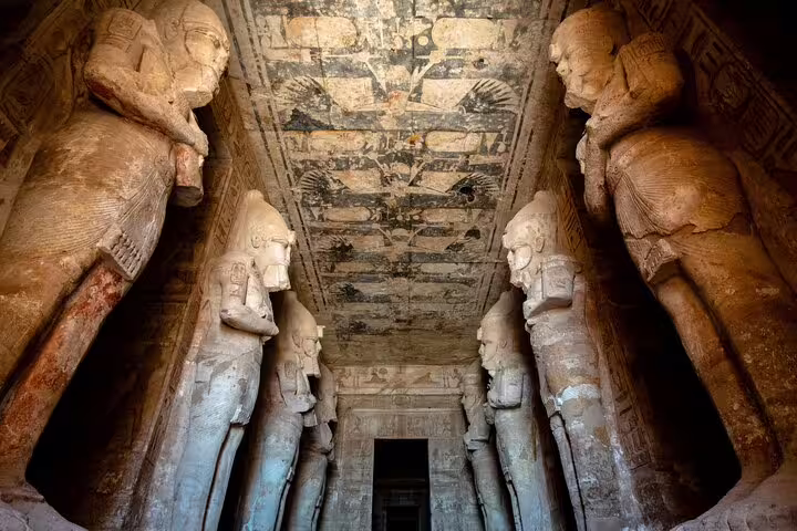 Great Temple of Abu Simbel interior with towering Ramses II statues on Abu Simbel day tour from Aswan
