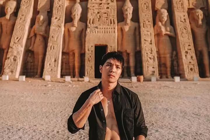 Close-up traveler at Abu Simbel temples from Aswan, private guided tour with hotel transfers in Egypt