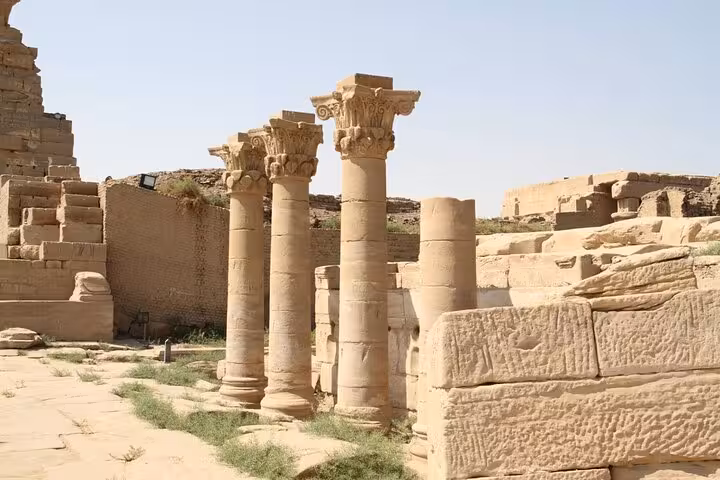 Ruins and carved columns at Abydos Temple on a day tour from Luxor, showcasing ancient Egyptian stonework