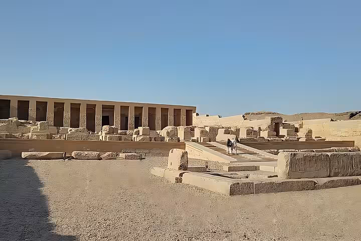 Wide view of Abydos temple ruins and desert courtyard on Dendera Osireion and Abydos tour