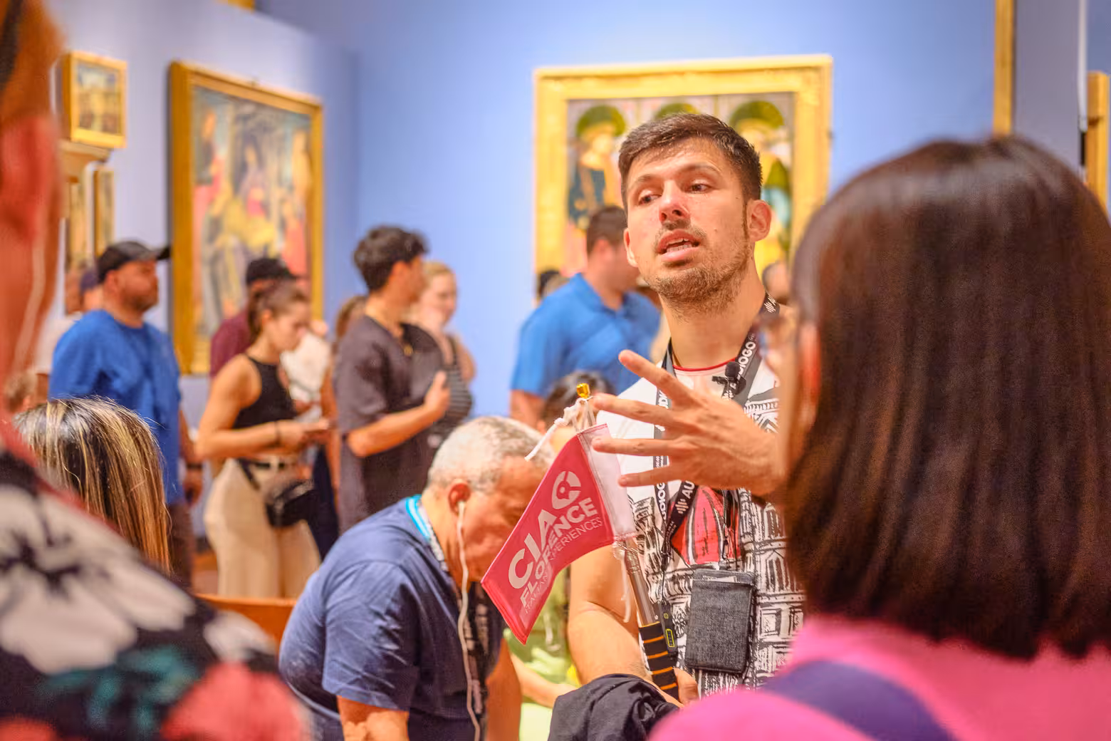 Engaged tourists on a private Accademia Gallery tour with skip-the-line entry, exploring art in Florence.