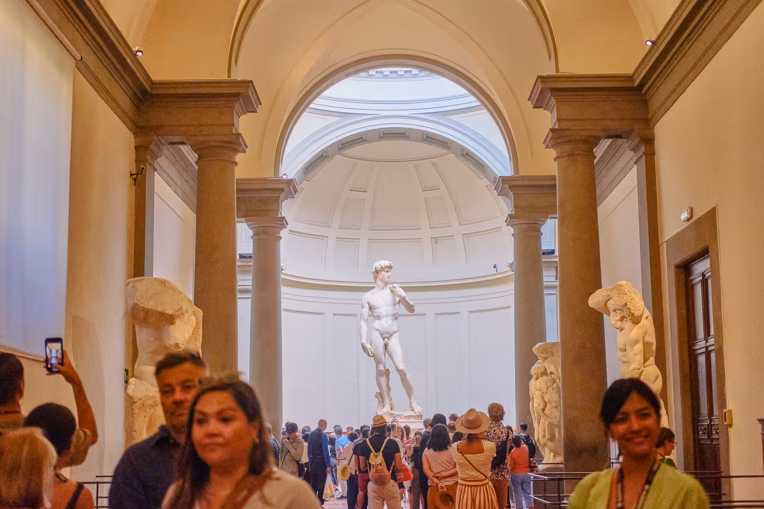 Visitors admire Michelangelo's David at Accademia Gallery during a private tour with skip-the-line access in Florence.