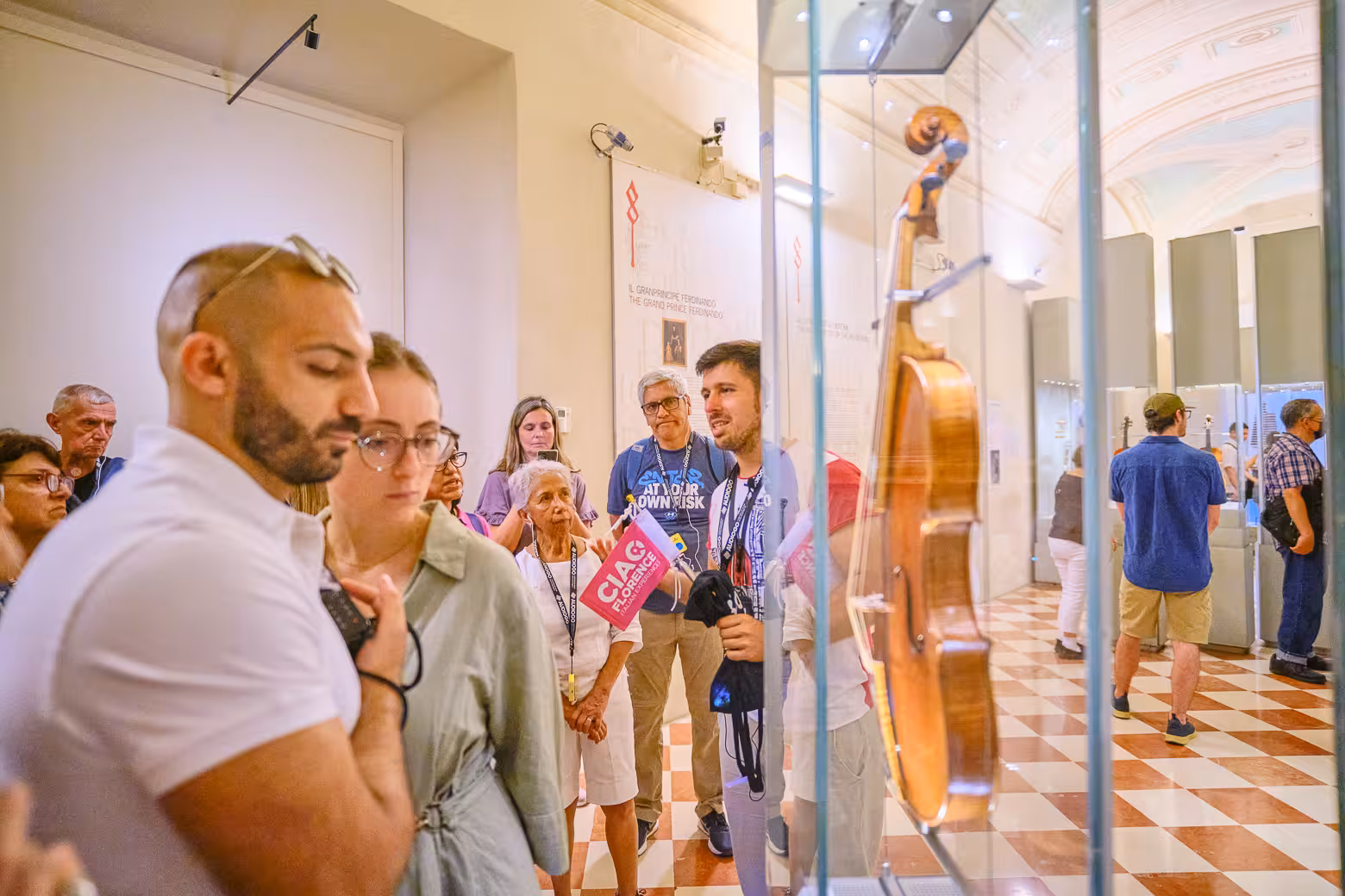 Group explores musical instrument exhibit on a private tour at Accademia Gallery with skip-the-line tickets in Florence.