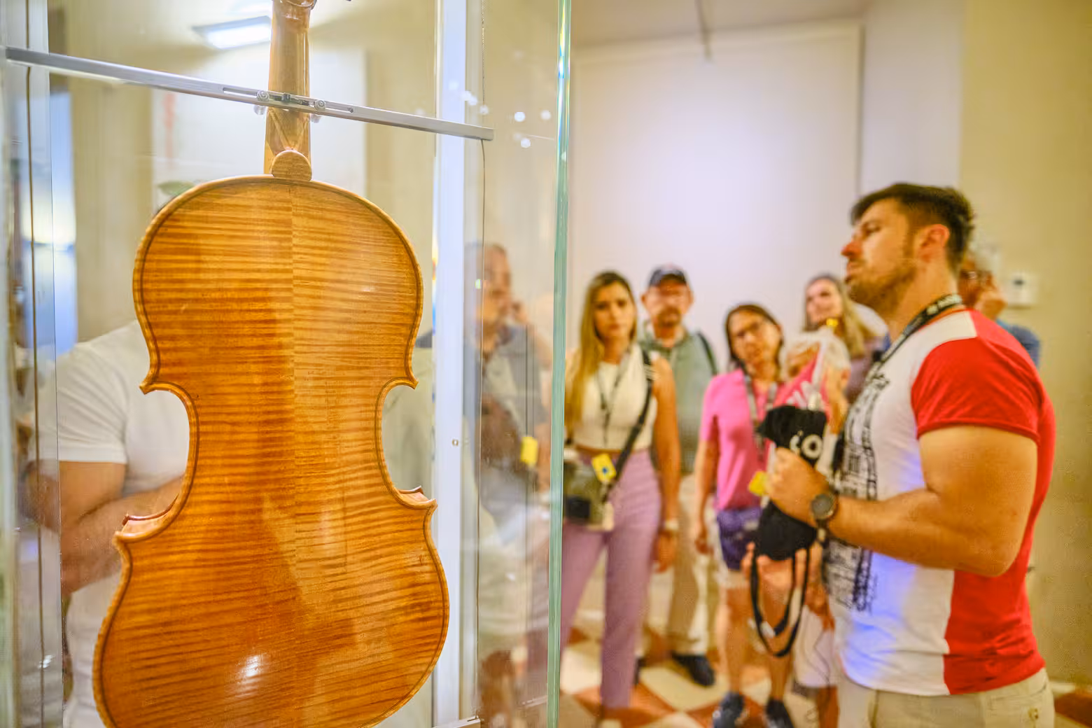 Tour group explores the musical instrument collection at Accademia Gallery on a private tour with skip-the-line tickets.