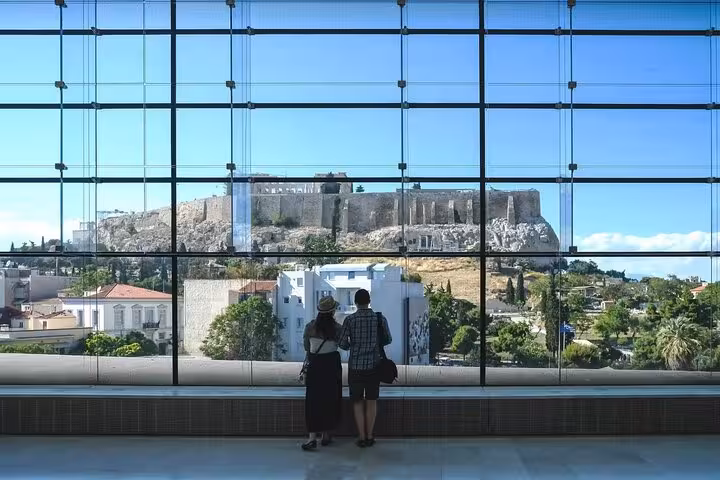 Acropolis hill seen through glass facade at Acropolis Museum, a highlight of a full-day private Athens tour
