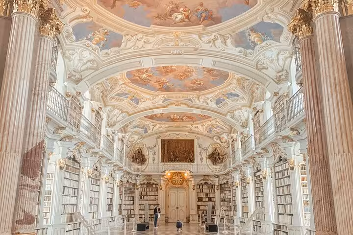 Admont Abbey Library hall with ornate columns and ceiling frescoes, highlight of Salzburg private day trip