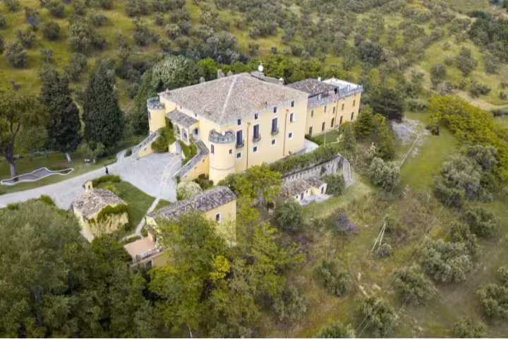 Aerial view of historic countryside villa surrounded by olive groves near Altomonte for 4-day Nature Friend Pollino Park stay