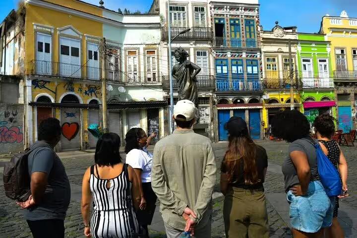 Tourists admire historic Afro-Brazilian architecture in Rio's Little Africa, highlighting vibrant cultural heritage.