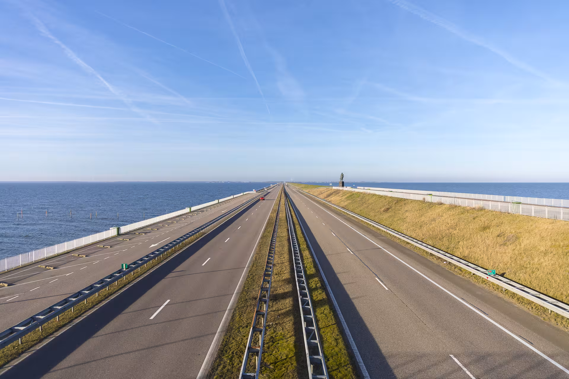 Afsluitdijk sea dike causeway over IJsselmeer, iconic Dutch waterworks on private tour from The Hague