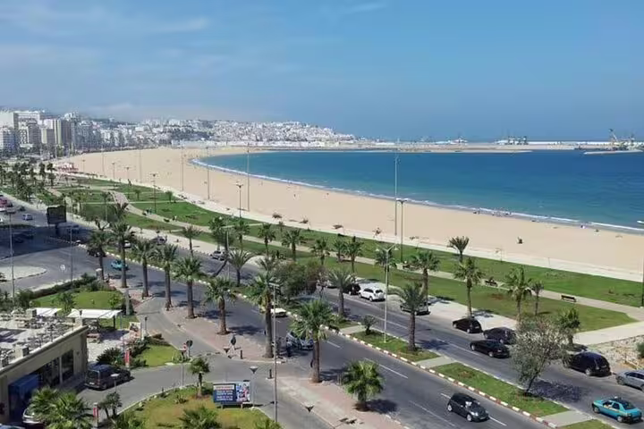 Agadir beachfront promenade with palm-lined boulevard and Atlantic coast views on Morocco 12-day tour from Tangier