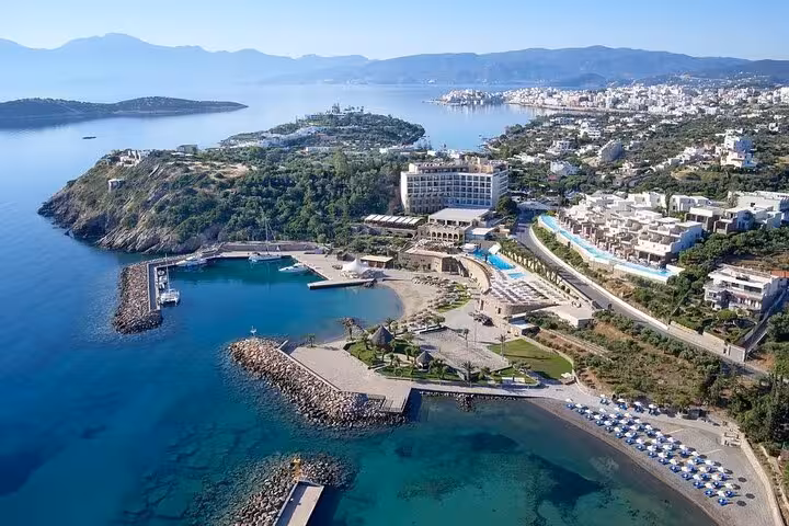 Aerial view of Agios Nikolaos coastline and marina near Heraklion on a 7-day private guided Crete tour