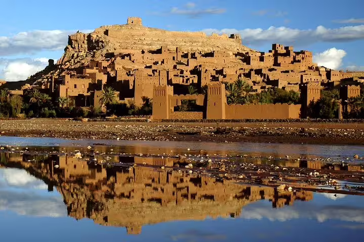 Ait Ben Haddou ksar reflected in river, UNESCO kasbah visit on Morocco Amazing 12 Days Tour from Tangier