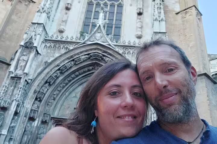 Couple selfie at Aix-en-Provence cathedral entrance, enjoying a self-guided scavenger hunt and sights tour