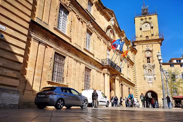 Aix-en-Provence City Hall and clock tower stop on full-day Aix, Cassis and Marseille guided tour
