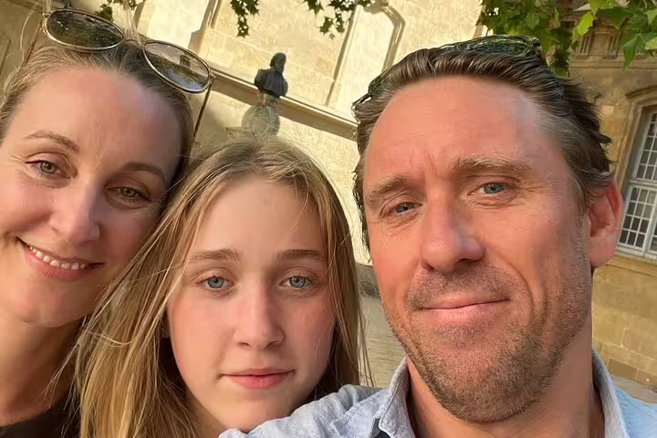 Family selfie in Aix-en-Provence old town while exploring clues on a self-guided scavenger hunt tour