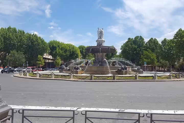 Aix-en-Provence Rotonde fountain on a sunny day, scenic stop on full-day tour to Cassis and Marseille from Aix
