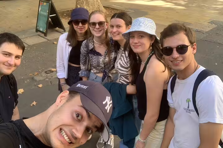 Friends selfie on Aix-en-Provence scavenger hunt, exploring landmarks on a self-guided walking tour