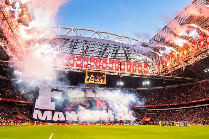 Johan Cruijff Arena Ajax home match in Amsterdam with giant tifo, smoke and fans on football tour day