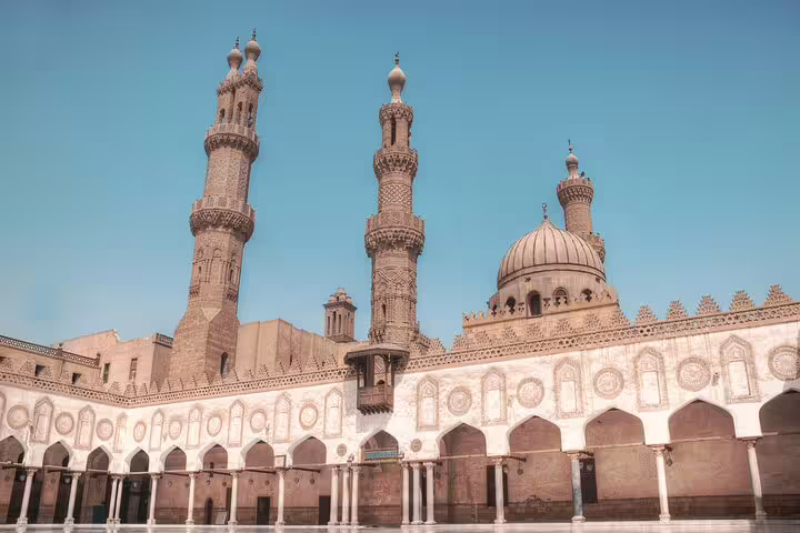 Al-Azhar Mosque courtyard with minarets and arches, stop on Citadel, Bazaar and Cairo Mosques Tour in Cairo