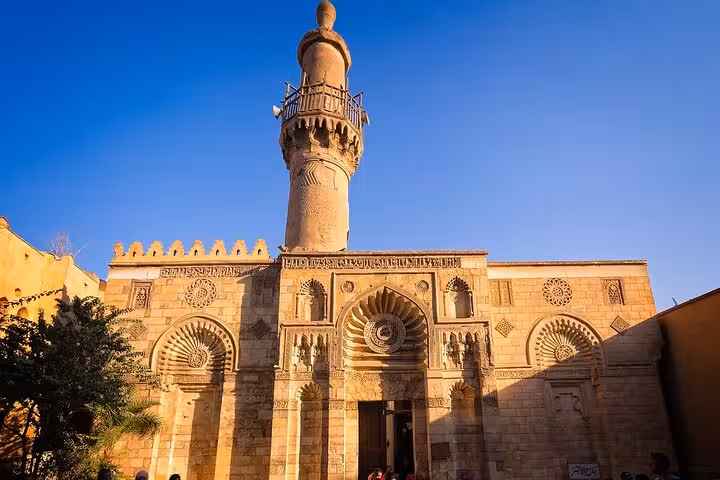Al Azhar Mosque facade and minaret at sunset, highlight stop on VIP Islamic Cairo private tour