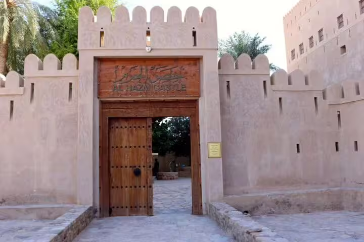 Discover the historic entrance of Al Hazm Castle, a highlight of the 2 Days 1 Night Wakan Private Tour in Oman.