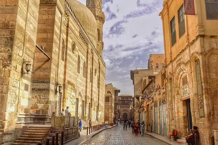 Al Moez Street in Islamic Cairo, historic mosques and stone facades on a guided Cairo by Night walking tour