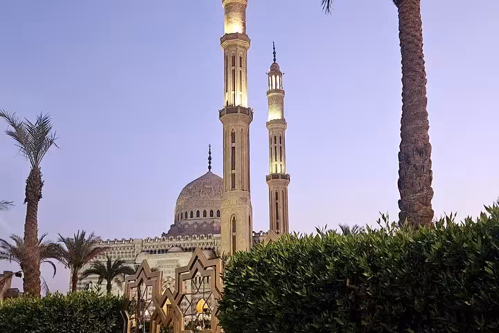 Al Mustafa Mosque twin minarets behind palm trees at sunset, Sharm El Sheikh guided sightseeing tour