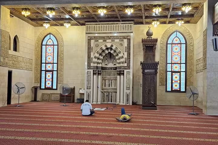 Interior of Al Sahaba Mosque in Sharm El Sheikh with stained glass and mihrab on guided city tour