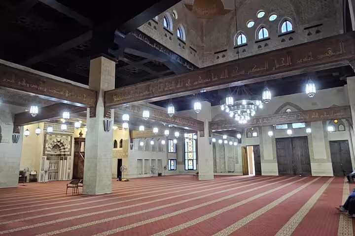 Wide prayer hall of Al Sahaba Mosque, Sharm El Sheikh, showcasing arches and lanterns on city tour
