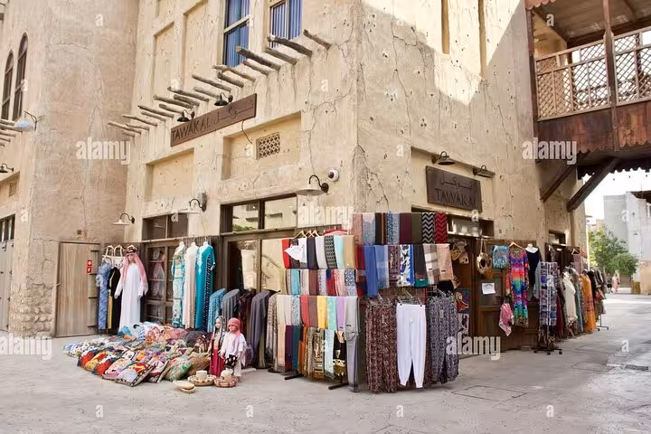 Al Seef old Dubai souk street with textile and souvenir stalls, part of customizable Gold Spice Souk tour
