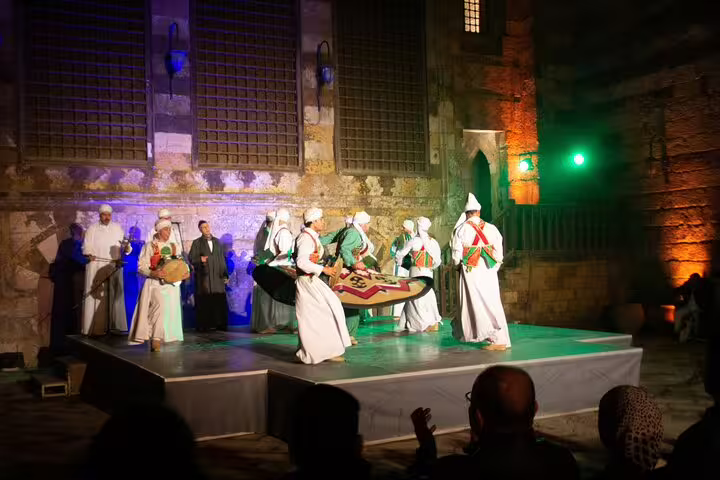 Cairo Al Tannoura Egyptian Heritage Dance Troupe performance with Sufi whirling dancers and traditional musicians